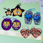 Custom gem decorated acrylic keychain with shiny crystal charm